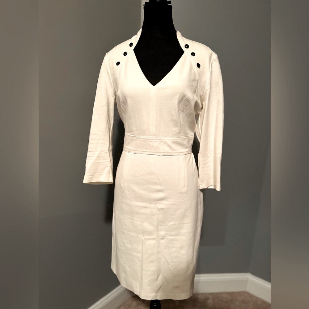 White House Black Market V-Cut Dress White with black buttons on the shoulders.